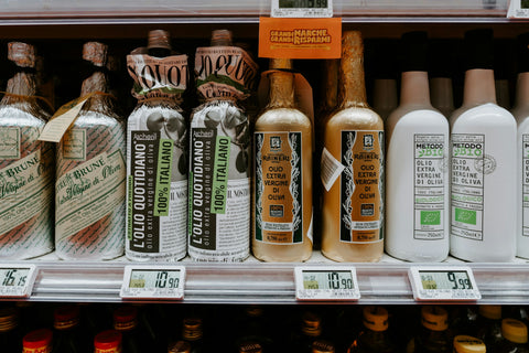 Grocery store aisle with olive oil bottles